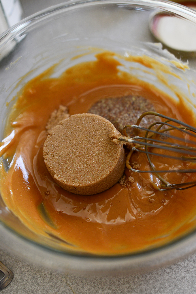 Whisking sugar into the Vegan Peanut Butter Thumbprint Cookie batter
