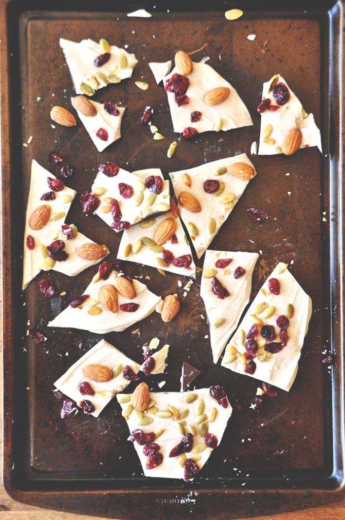 Baking sheet filled with Pumpkin Bark made from cranberries, almonds, and pumpkin seeds