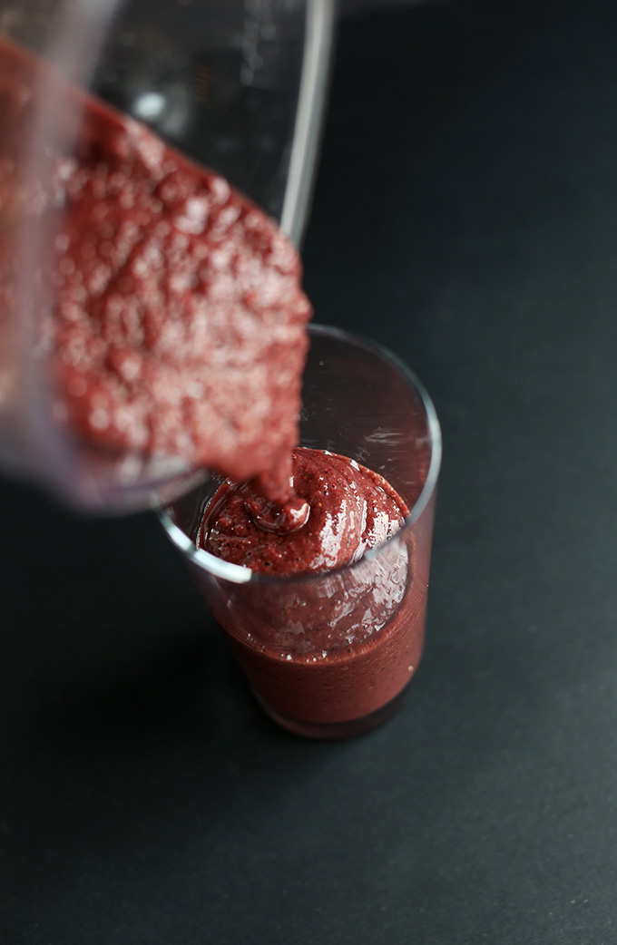 Pouring a batch of our Detox Smoothie recipe into a glass