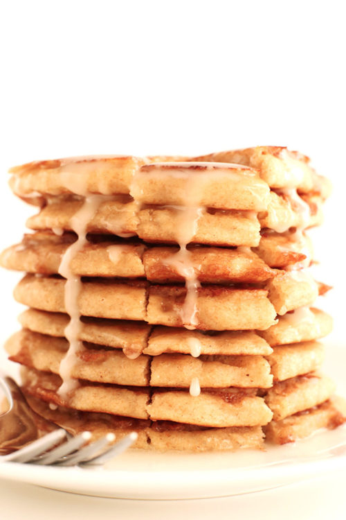 Stack of our Fluffy Vegan Cinnamon Roll Pancakes recipe with icing