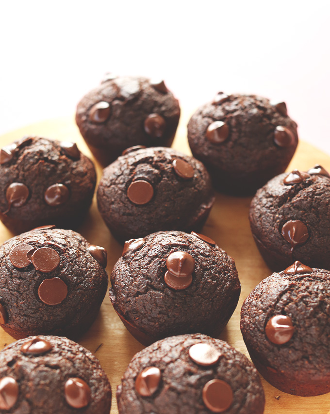 Batch of Healthy Chocolate Muffins resting on parchment paper