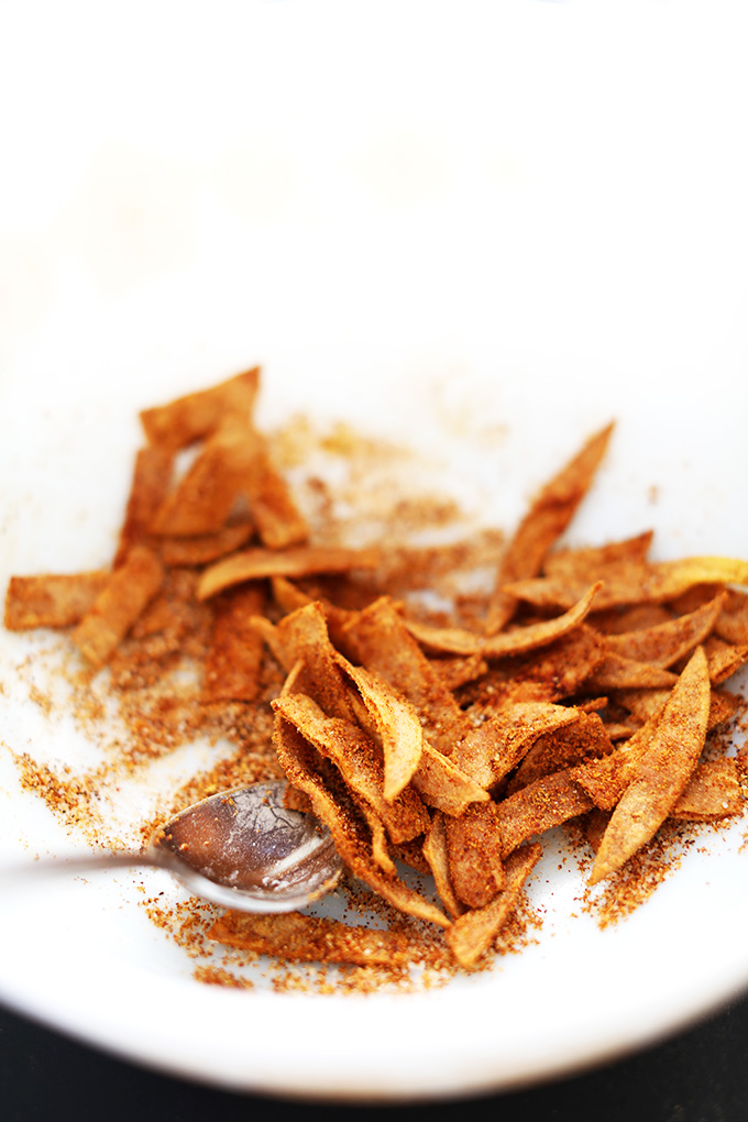 Picking up a spoonful of delicious vegan DIY Chili Cheese Fritos