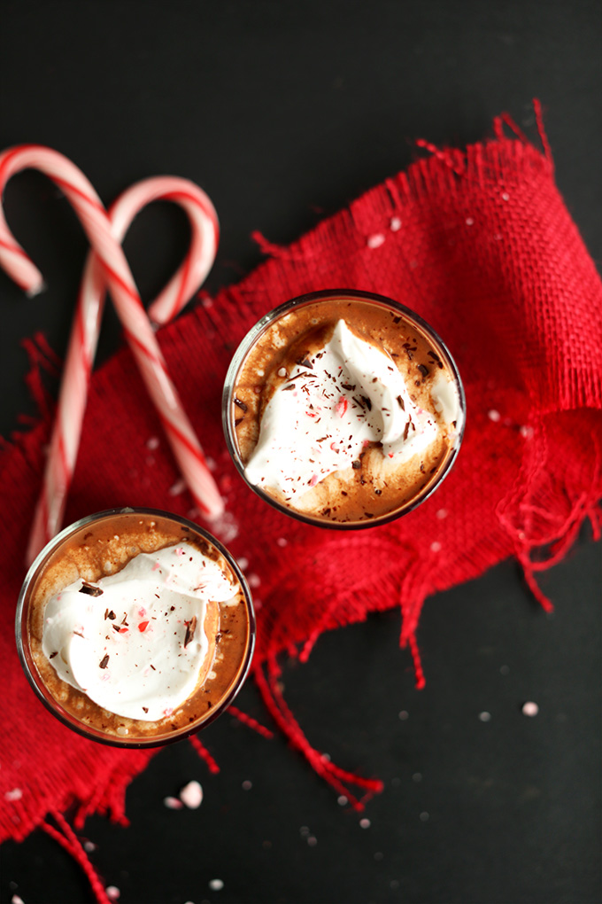 Glasses of Peppermint Vegan Drinking Chocolate topped with coconut whipped cream