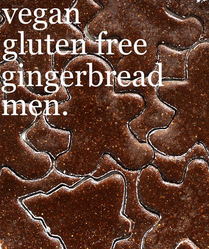 Cookie dough cut into Gingerbread Men shapes for Christmas cookies