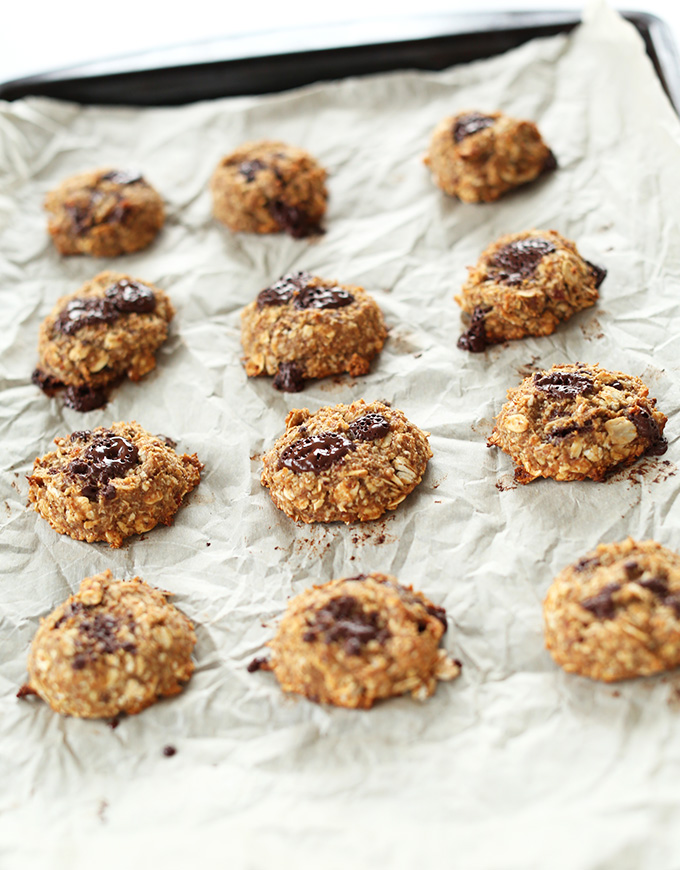 Freshly baked Vegan Cookies on a parchment-lined baking sheet