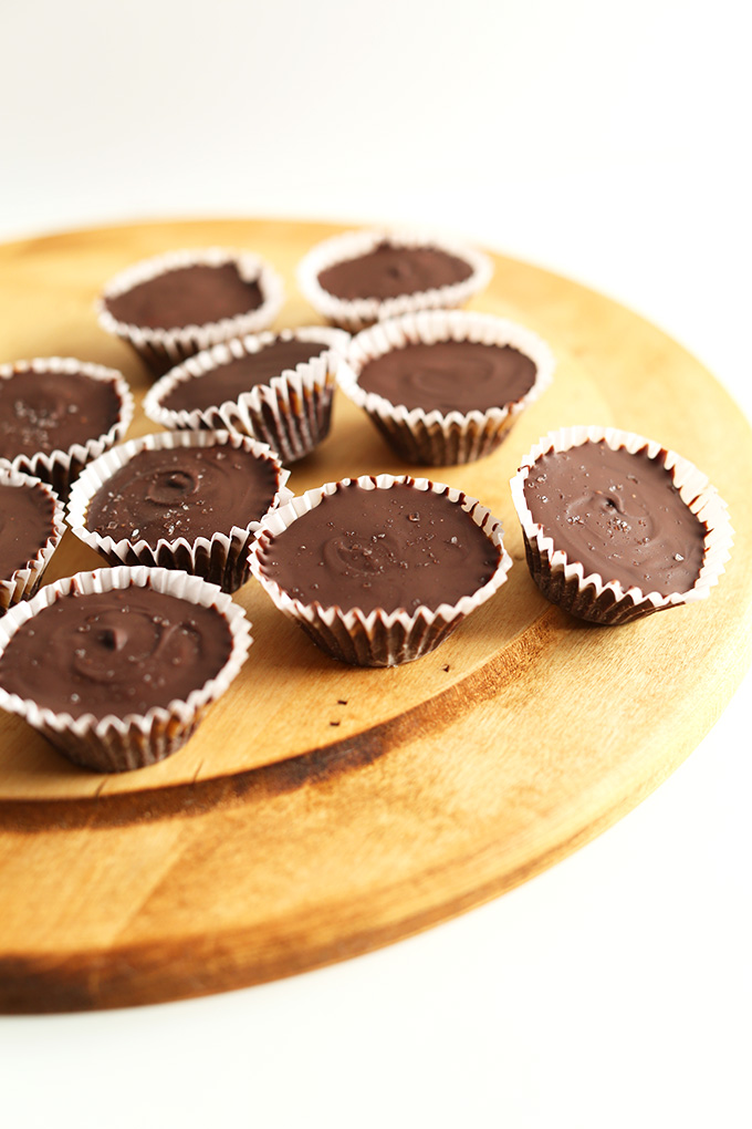 Cutting board with a batch of our Bourbon Caramel Almond Butter Cups recipe