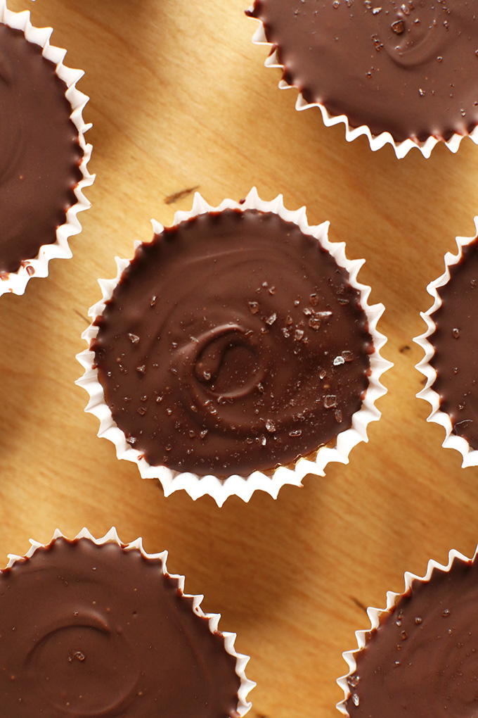 Top down shot of Bourbon Caramel Almond Butter Cups sprinkled with sea salt
