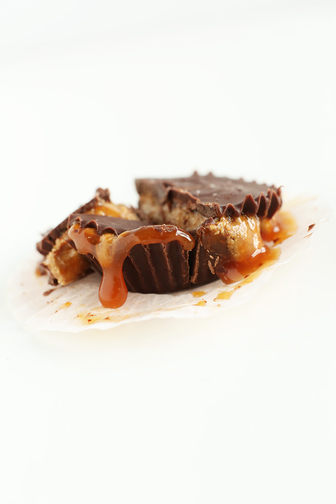 Bourbon caramel oozing out of a homemade vegan Caramel Almond Butter Cup