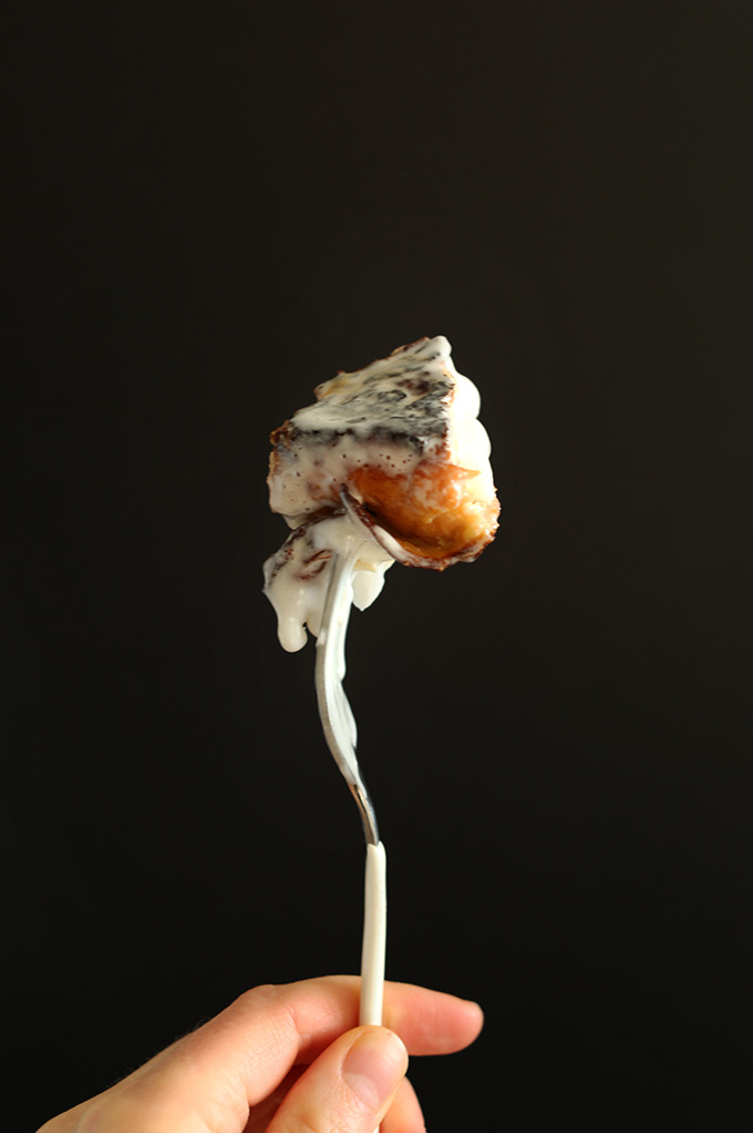 Holding up a bite of Coconut Cream Pie French Toast on a fork