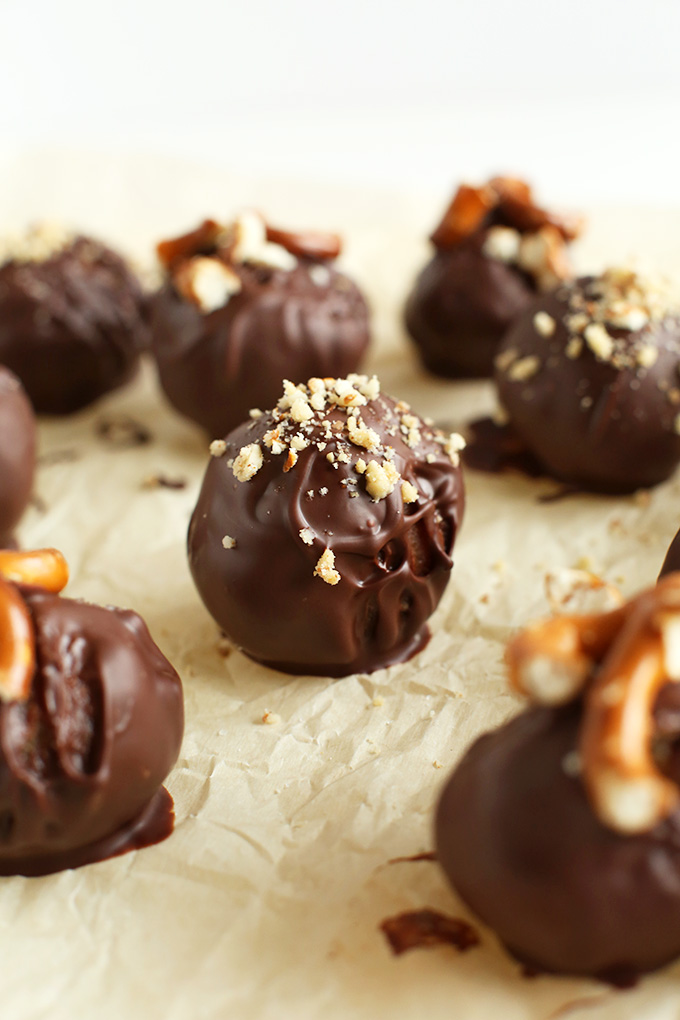 Peanut Butter Pretzel Dark Chocolate Truffles on parchment paper