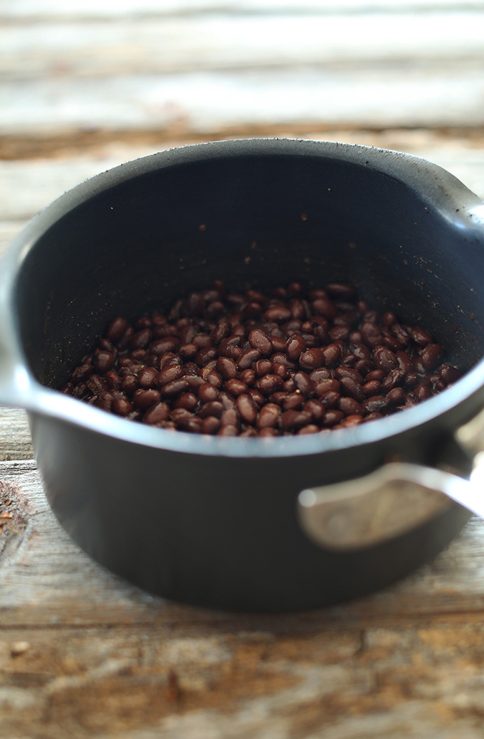 Saucepan of black beans for making homemade vegan chipotle bean dip