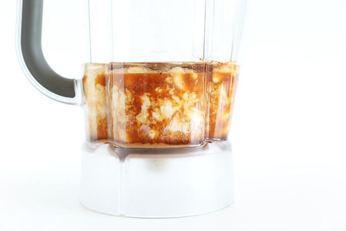 Side view of blender with ingredients for Creamy Vegan Chai Ice Cream