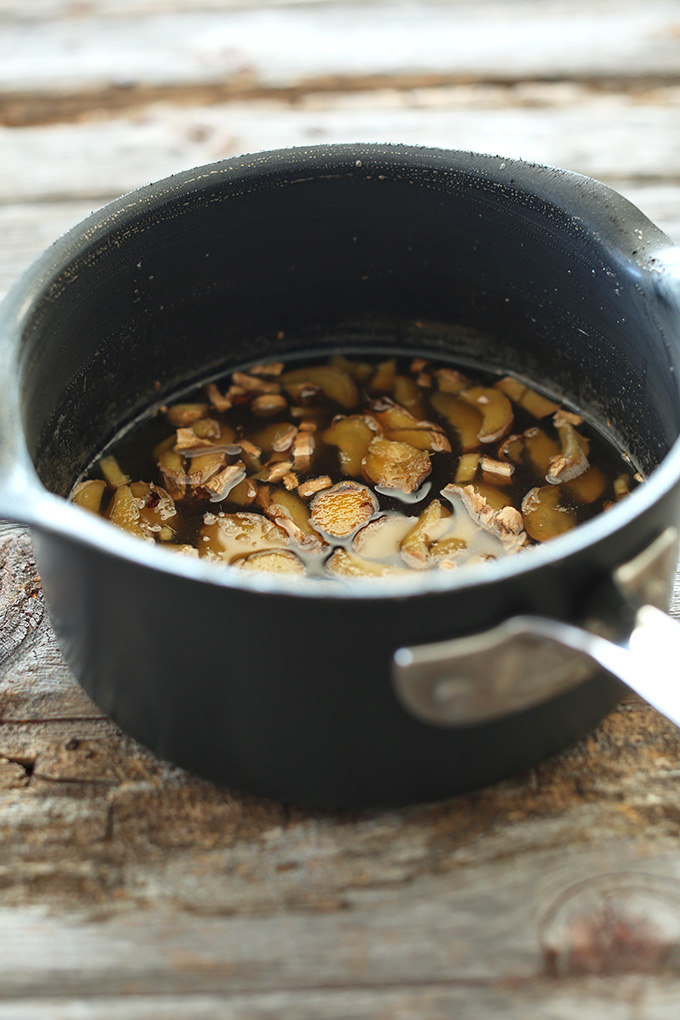 Making homemade ginger syrup in a saucepan
