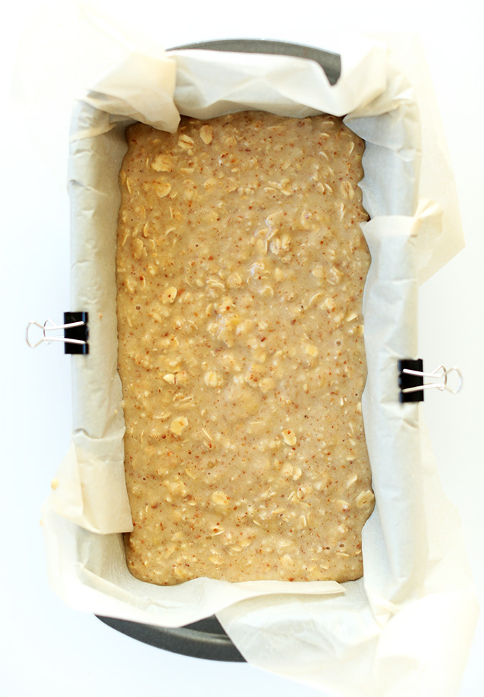 Gluten free banana bread batter in a loaf pan ready to go in the oven