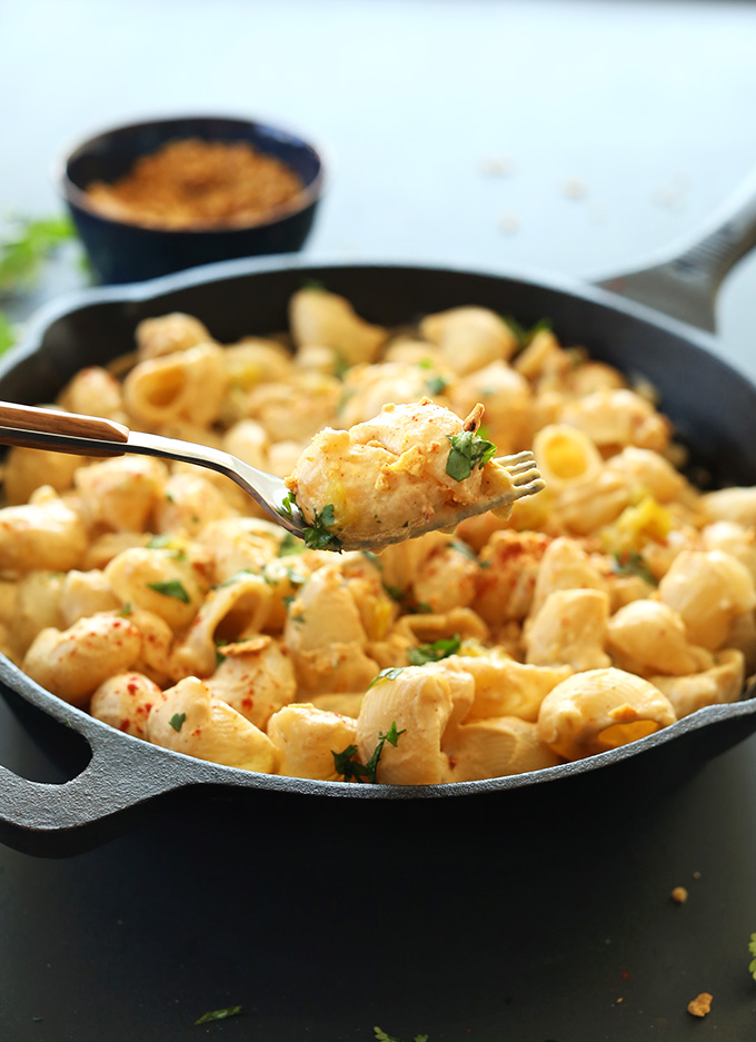Holding up a bite of Green Chili Mac n Cheese on a fork