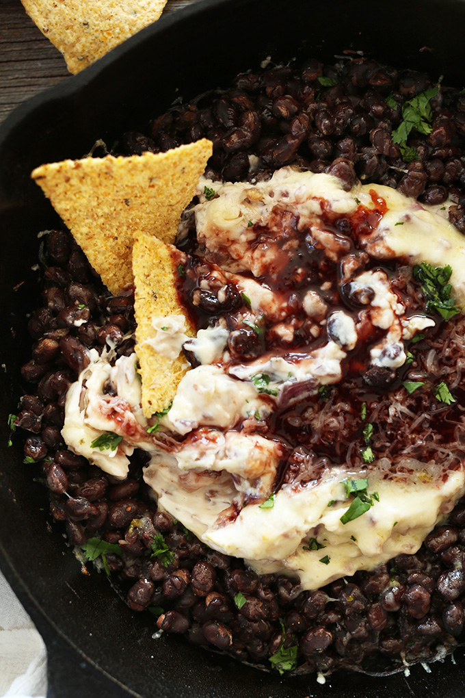 Close up shot of Raspberry Chipotle Black Bean Dip made with vegan cheddar
