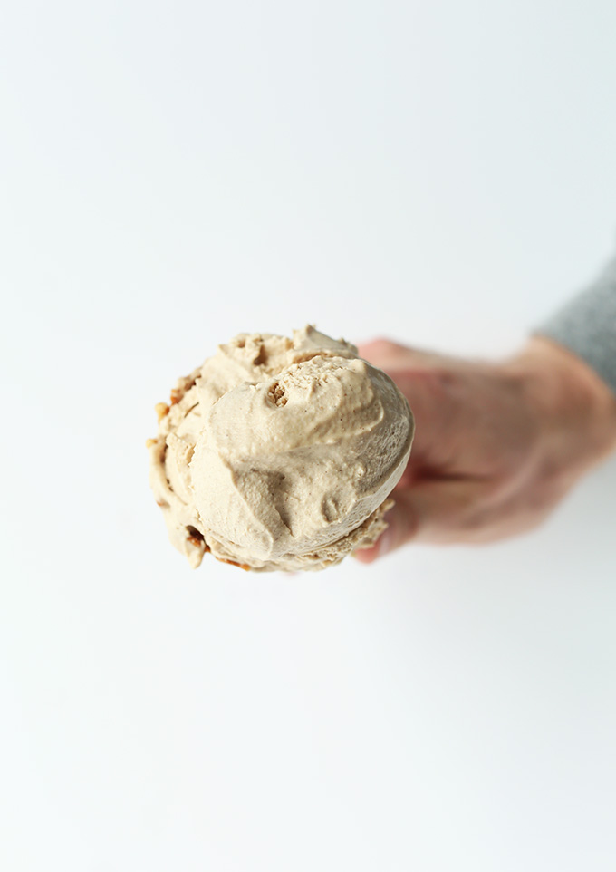 Holding up a cone with a scoop of Creamy Vegan Chai Ice Cream in it