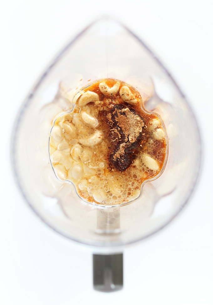 Blender containing ingredients for homemade Vegan Chai Ice Cream