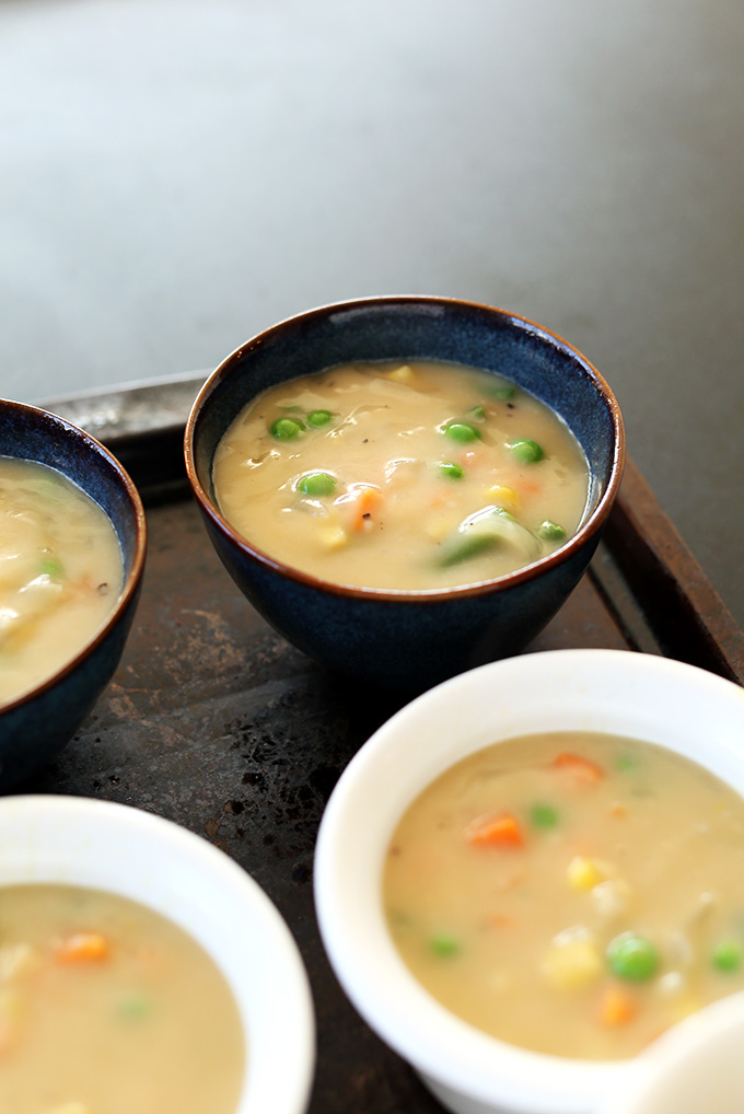 Bowls filled with the filling layer of Vegan Pot Pies