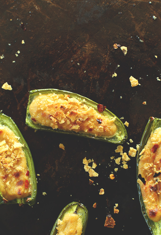 Baking sheet scattered with Vegan Gluten-Free Jalapeno Poppers
