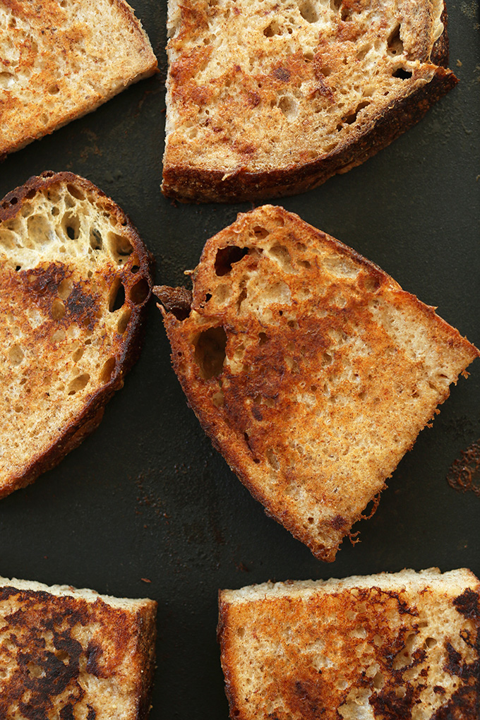 Slices of Vegan French Toast on a baking sheet