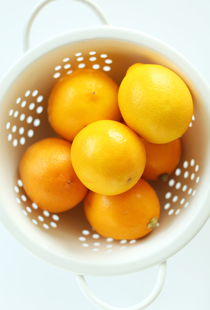 Colander of fresh meyer lemons for making delicious poppyseed muffins