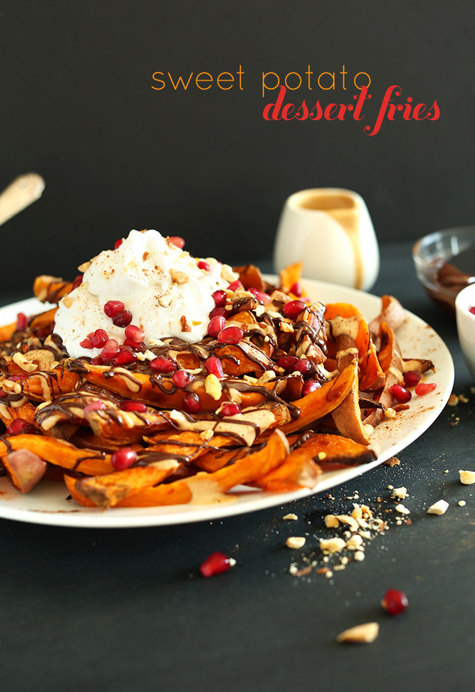 Plate of Sweet Potato Dessert Fries topped with pomegranate seeds, coconut whipped cream and more