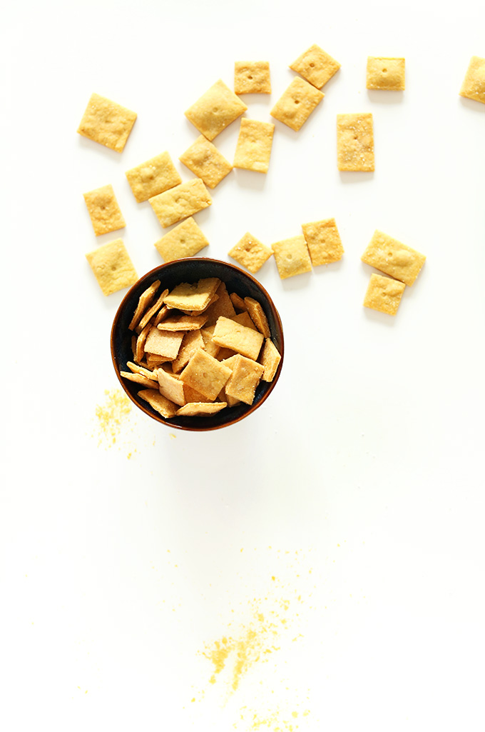 Bowl and scattering of homemade Vegan Cheez Its 