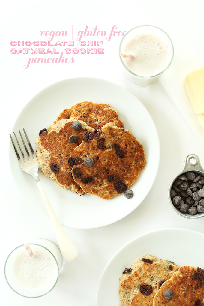 Plates of Chocolate Chip Cookie Pancakes with glasses of almond milk