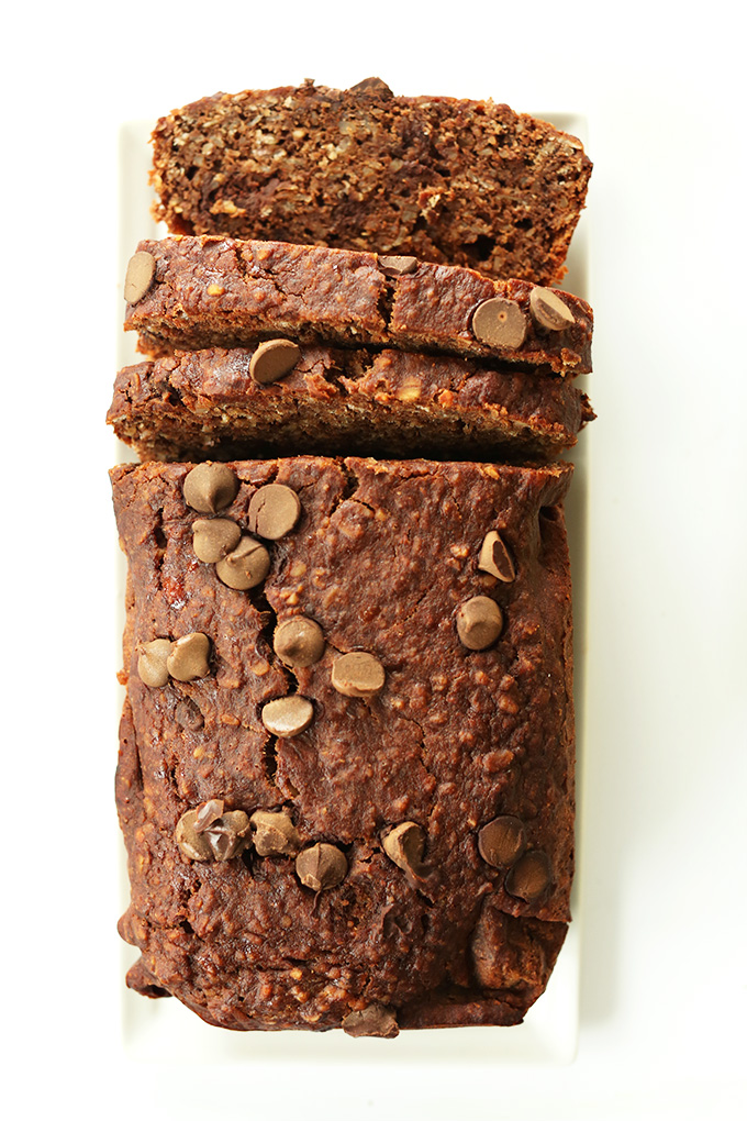 Partially sliced loaf of Peanut Butter Banana Chocolate Snack Bread