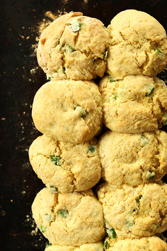 Batch of freshly baked Vegan Cheddar Jalapeno Biscuits on a baking sheet