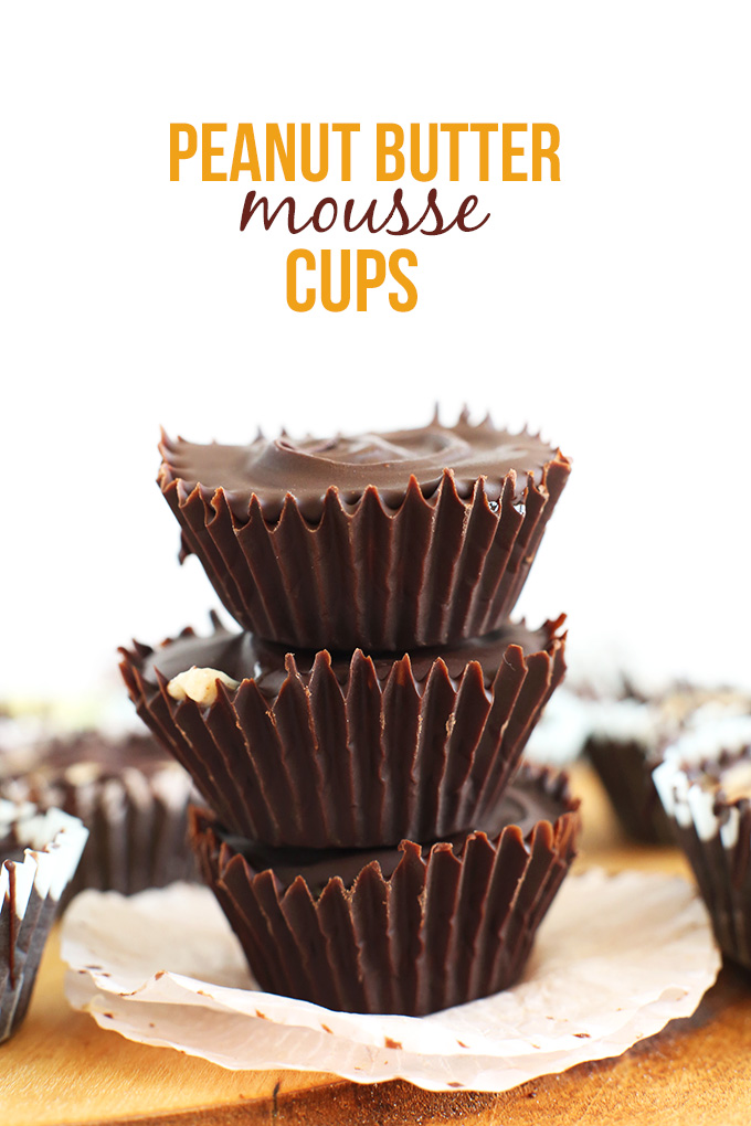 Stack of Vegan Peanut Butter Mousse Cups with their parchment paper holders removed