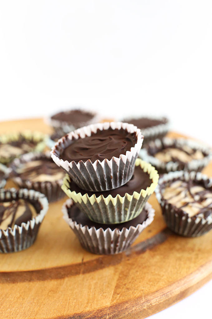 Stack of Vegan Peanut Butter Mousse Cups with a crunchy chocolate shell