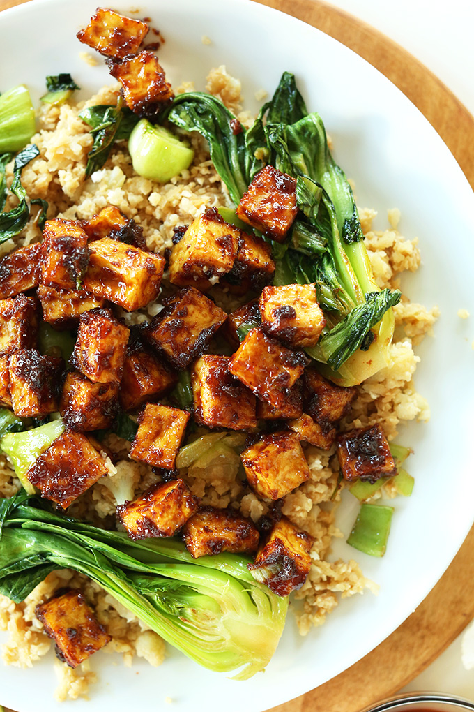 Plate of Peanut Glazed Crispy Baked Tofu over cauliflower rice and bok choy