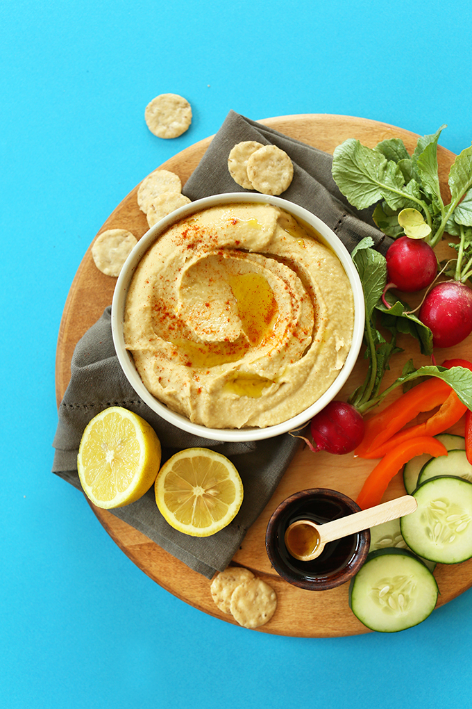 Wood platter of veggies and delicious homemade hummus