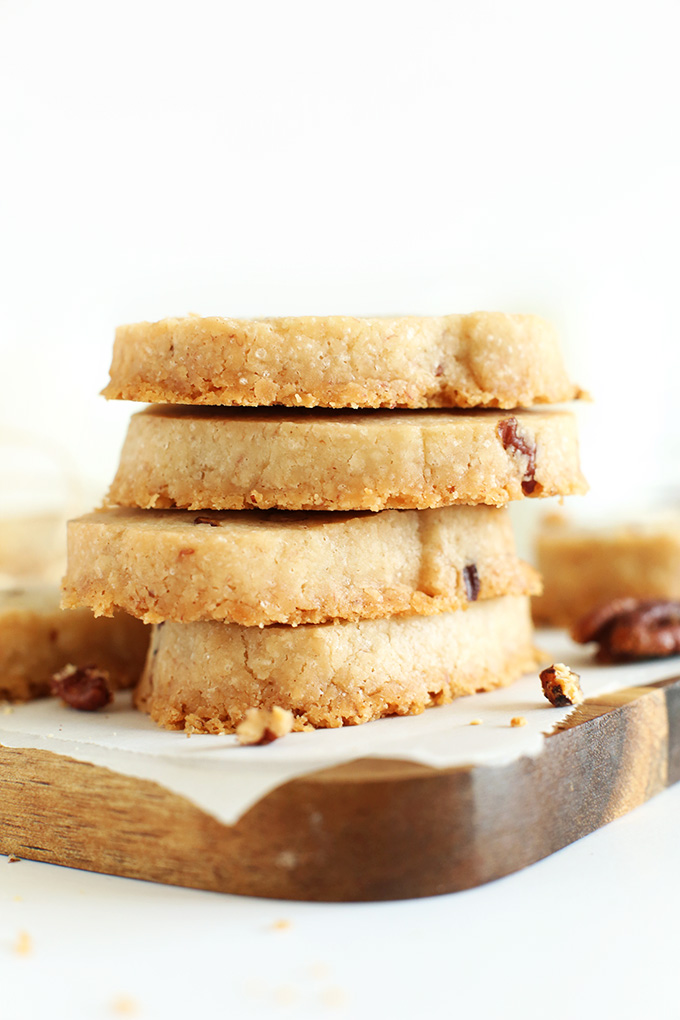 Cutting board with a stack of vegan Banana Pecan Shortbread Cookies