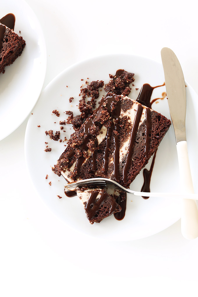 Grabbing a bite of a slice of Fudgy, Creamy Vegan Chocolate Mint Ice Cream Cake