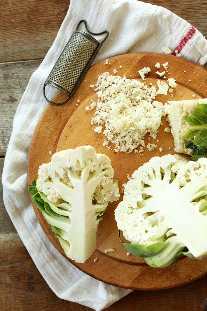 Chopped head of cauliflower with part of it turned into Cauliflower Rice