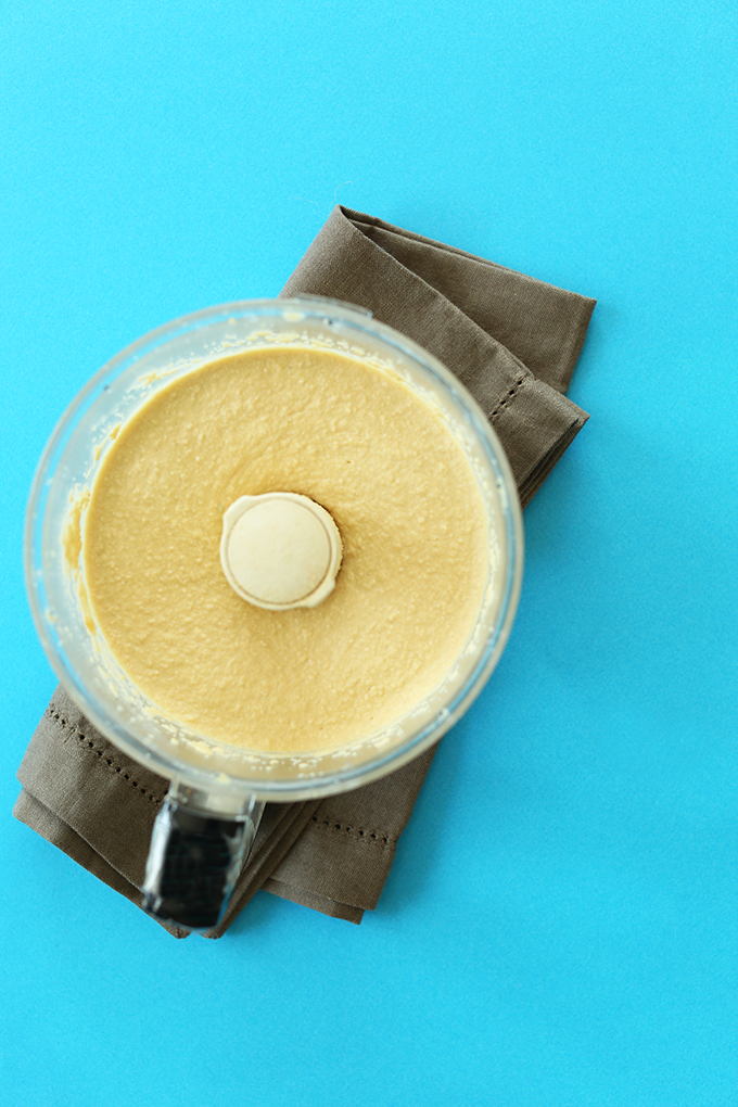 Food processor filled with a batch of our 5-Minute Microwave Hummus recipe