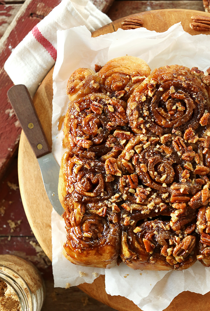 Batch of our Easy Vegan Sticky Buns topped with sticky glaze and pecans