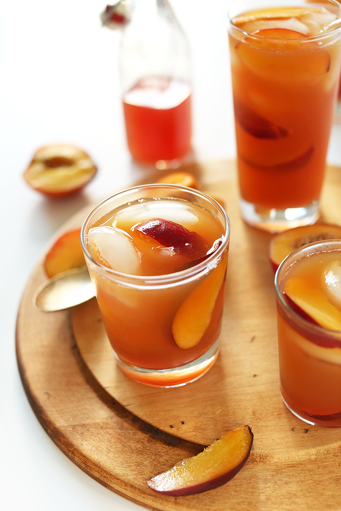 Glasses of Sweet Peach Iced Tea with ice cubes and slices of peaches in them