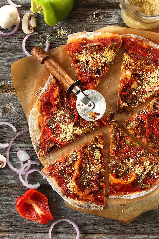 Pizza cutter and slices of the Best Vegan Pizza