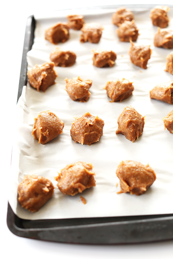 Vegan Salted Caramel Balls on a parchment-lined baking sheet