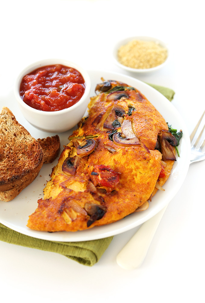 Vegan breakfast plate filled with our Vegan Omelet, salsa, and toast