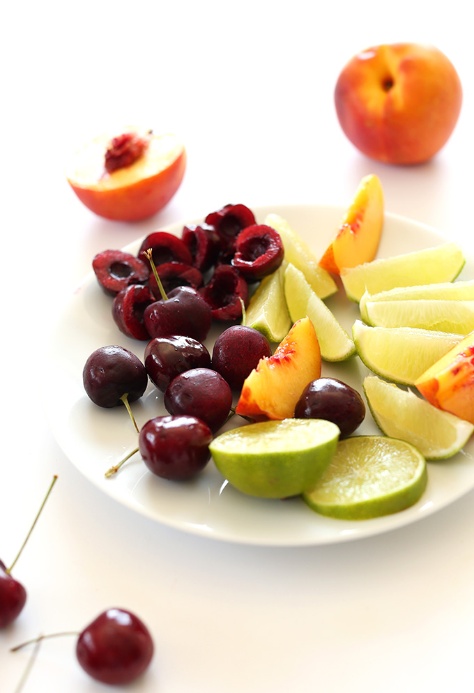 Plate of colorful fruit for making our Cherry Limeade Smoothie recipe