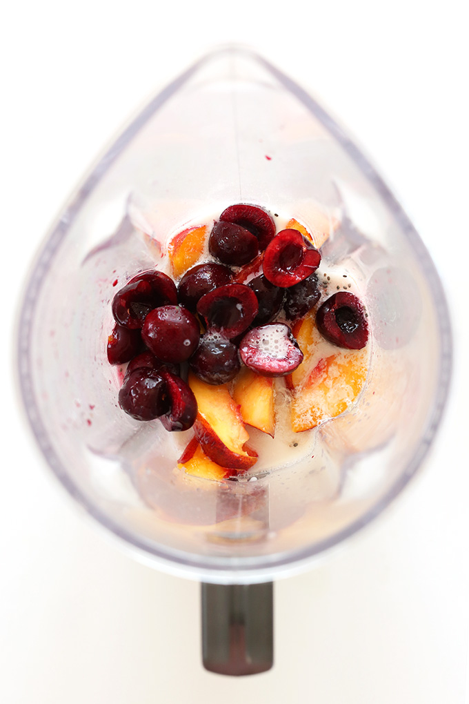 Blender with fresh fruit for making a Cherry Limeade Smoothie