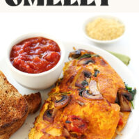 Plate of our simple vegan omelet with a bowl of salsa and text above the photo that says easy and packed with protein
