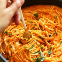 Using a fork to swirl a bite of Vegan Roasted Red Pepper Pasta