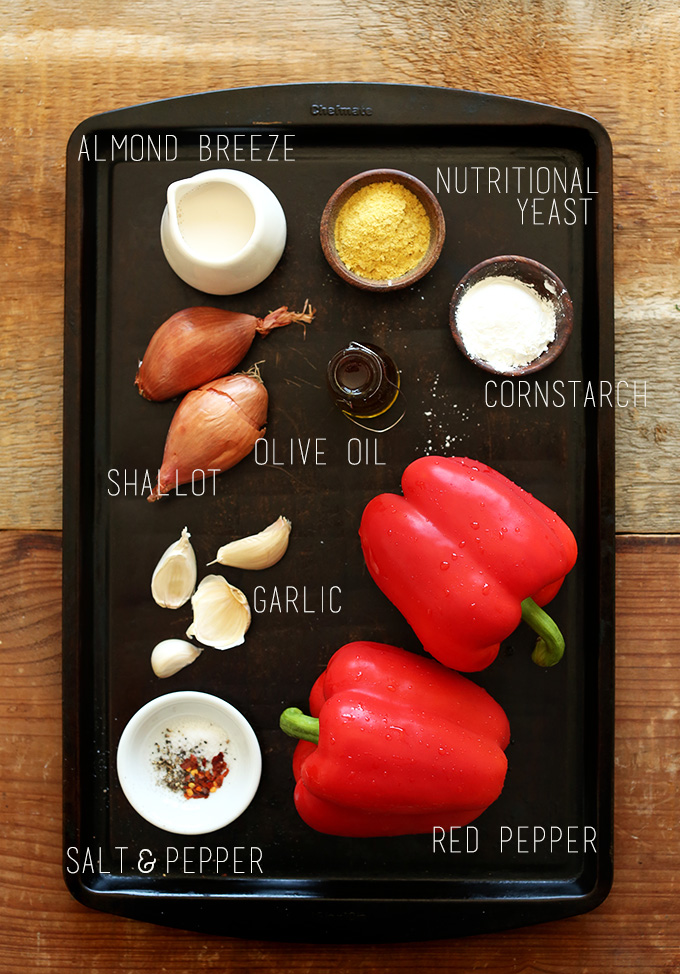 Bell peppers, garlic, shallots, and other ingredients for making vegan Roasted Red Pepper Pasta Sauce