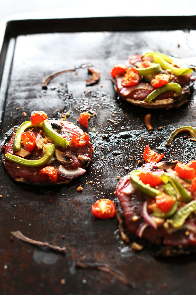 Baking sheet with gluten-free Portobello Pizzas for a simple vegan dinner